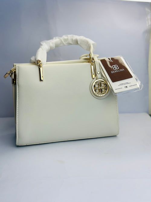 BERELINA SIGNATURE WHITE SATCHEL WITH GOLD EMBLEM DETAIL