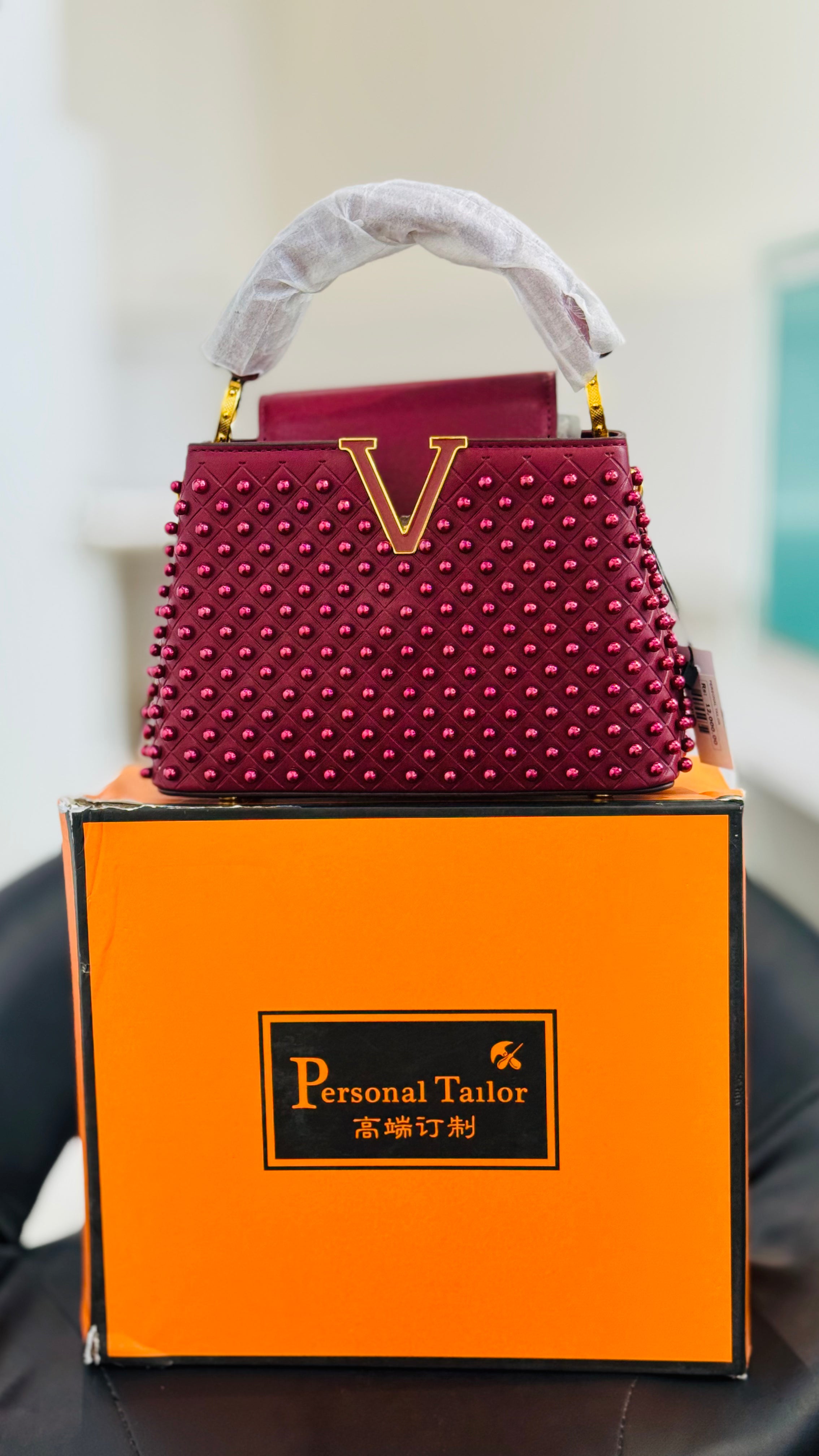Luxury Burgundy Studded Top Handle Handbag with Gold V Accent | Elegant Statement Purse